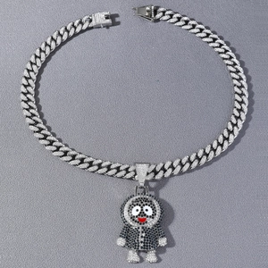 Close-up of iced out hip hop cartoon character pendant on silver cuban link chain necklace