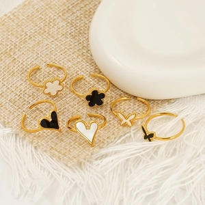 Adjustable stainless steel clover heart rings set in gold with black and white enamel
