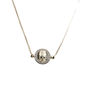 Golden necklace with Indian headdress skull pendant and purple gems on white background