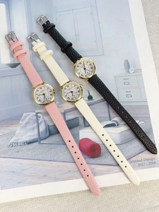 Macro detail of three quartz watches with Roman numeral dials and leather straps
