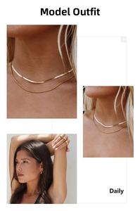 Close-up of layered gold snake and twisted rope chains set on a female model