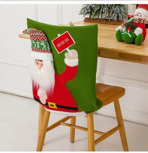 Detailed view of Santa Claus chair cover on wooden chair with festive Christmas decor