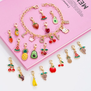 DIY charm bracelet with fruit and rabbit enamel pendants and lobster clasps