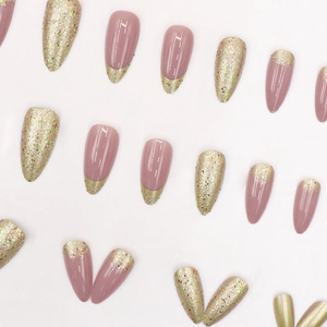 Sparkly gold and rose pink almond press-on nails with French gradient glitter finish