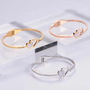 Elegant heart-shaped steel bracelets with shell inlay in gold, rose gold and silver