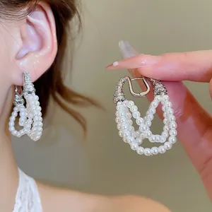 Elegant multi-layer pearl fringe earrings with silver rhinestone horseshoe clasps