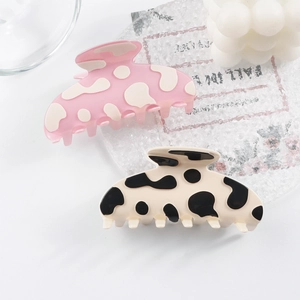 Pinces à cheveux chic à motif vache rose et noir et blanc pour des coiffures élégantes