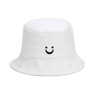 Detail of smile embroidery and stitching on white canvas kids bucket hat