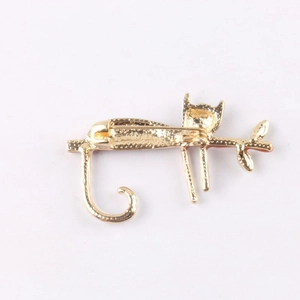 Detail view of the secure pin clasp and gold alloy backing of the cute cat brooch