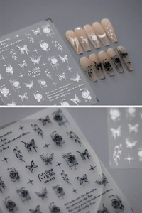 Detail view of Miisha Nail embossed stickers with butterfly and rose floral patterns