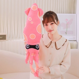 Pink plush squid toy with orange polka dots and tentacles, soft long ocean animal pillow