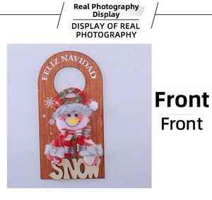 Detail of wooden Christmas door hanger with 3D snowman and Feliz Navidad greeting text