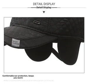 Detail view of winter quilted baseball cap showing ear flaps and warm fleece lining