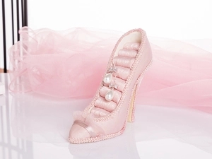 Pink satin high heel jewelry display stand with lace trim and six soft ring storage slots