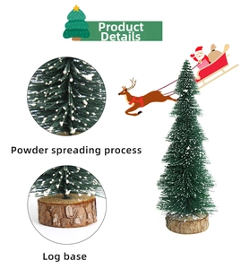Detail of mini artificial Christmas tree with snow-dusted needles and natural wood base