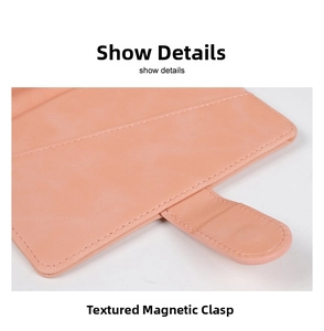 Detailed close-up of pink leather passport holder with a high-quality magnetic buckle closure