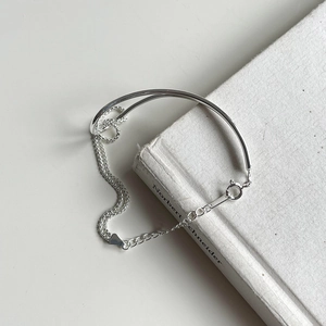 Minimalist S925 sterling silver knotted bracelet featuring a half-solid tube and chain design