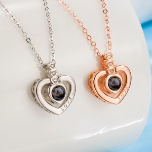 Projection heart necklace in silver and rose gold with 100 languages of I love you