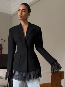 Detailed view of women black lace blazer featuring delicate hem lace and flap pockets