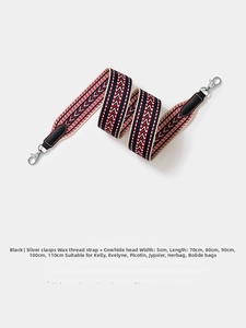 Detail of 5cm wide black woven shoulder strap with silver buckle and leather ends