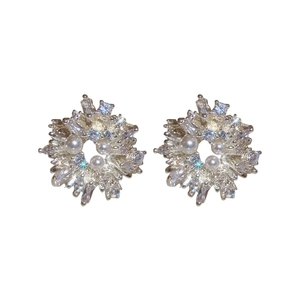 Elegant snowflake earrings with silver posts, sparkling cubic zirconia and pearls