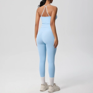 Rear view of light blue yoga set featuring a criss-cross back sports bra and high-waisted leggings