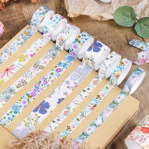 Floral dream gold-foiled washi tape set on kraft notebook with natural dried flowers