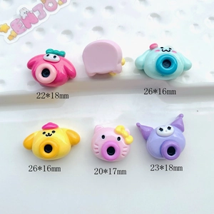 Detailed macro view of assorted colorful acrylic cartoon charms for DIY jewelry making