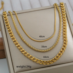 Three-layer gold titanium steel necklace set with snake, popcorn, and cuban chains