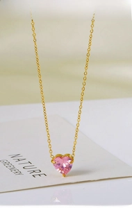 Detailed close-up of pink heart crystal pendant on 18k gold-plated stainless steel chain