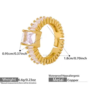 Macro detail of gold-plated copper ring with large square zircon and side stones