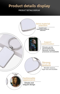 Detailed macro view of heart-shaped metal keychain with customizable white insert panel