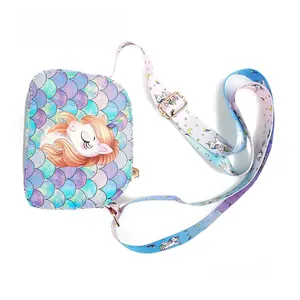 Detail view of unicorn kids crossbody bag with iridescent scales and colorful strap