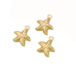 Three golden starfish pendants with rings for DIY jewelry necklaces on white background
