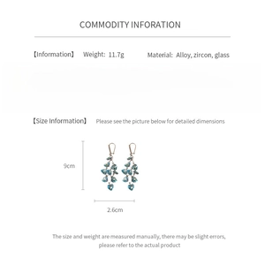 Detailed spec sheet showing 9cm blue heart tassel earrings weighing 11.7g with dimensions