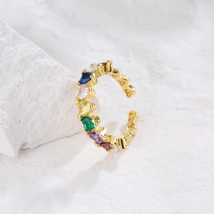 18K gold plated open ring with colorful heart-shaped cubic zirconia on a white stone base