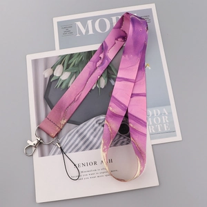 Detail of purple marble lanyard with gold veins, metal lobster claw and black loop