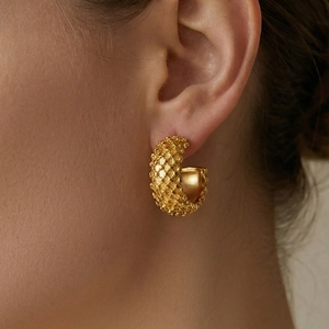 Elegant 18k gold plated stainless steel C-shape earrings with quilted texture on model
