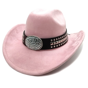 Detail of pink faux suede cowboy hat with studded leather band and rhinestone oval buckle