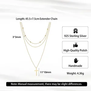 Elegant 925 sterling silver triple-layer cross necklace with gold finish and bead charms