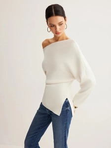 Elegant off-shoulder long sleeve white knit top paired with stylish blue jeans for women
