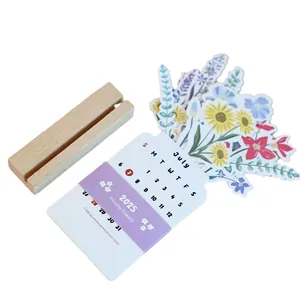 2025 Bloomy Flowers desk calendar with floral illustrations and a natural wooden base
