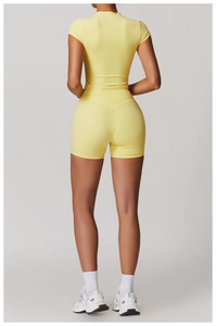 Back view of high-stretch sports yoga set with fitted short sleeve top and high waist shorts