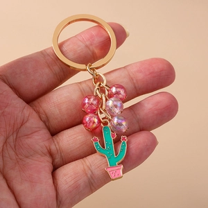 Detailed view of pastoral beaded cactus keychain with pink beads and golden ring
