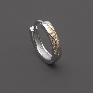 Silver earring with golden lava texture finish shown from a professional side angle
