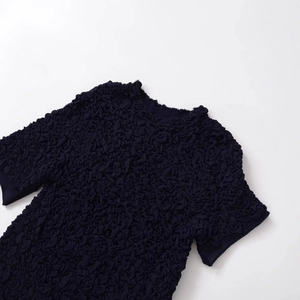 Short sleeve textured knit top with bow-knot round neck in a stylish dark blue finish