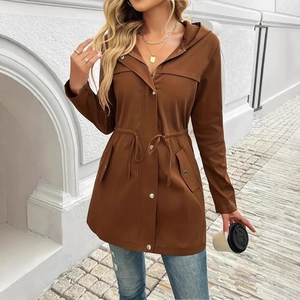 Detail of a brown hooded utility jacket featuring adjustable waist drawstrings and pockets