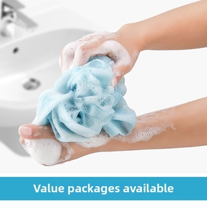 Close-up of blue mesh bath sponge creating rich white foam for deep skin cleaning