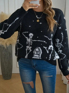 Women's black crewneck knit sweater with white skull and tombstone Halloween pattern
