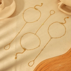 Gold-plated hand chain set with sparkling cubic zirconia and a delicate cross pendant